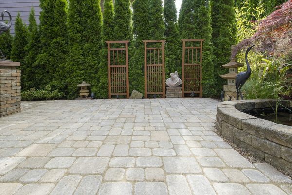 Backyard Paver Patio With Pond And Garden Decoration